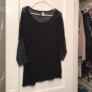 Black knit top with faux leather accent sleeves